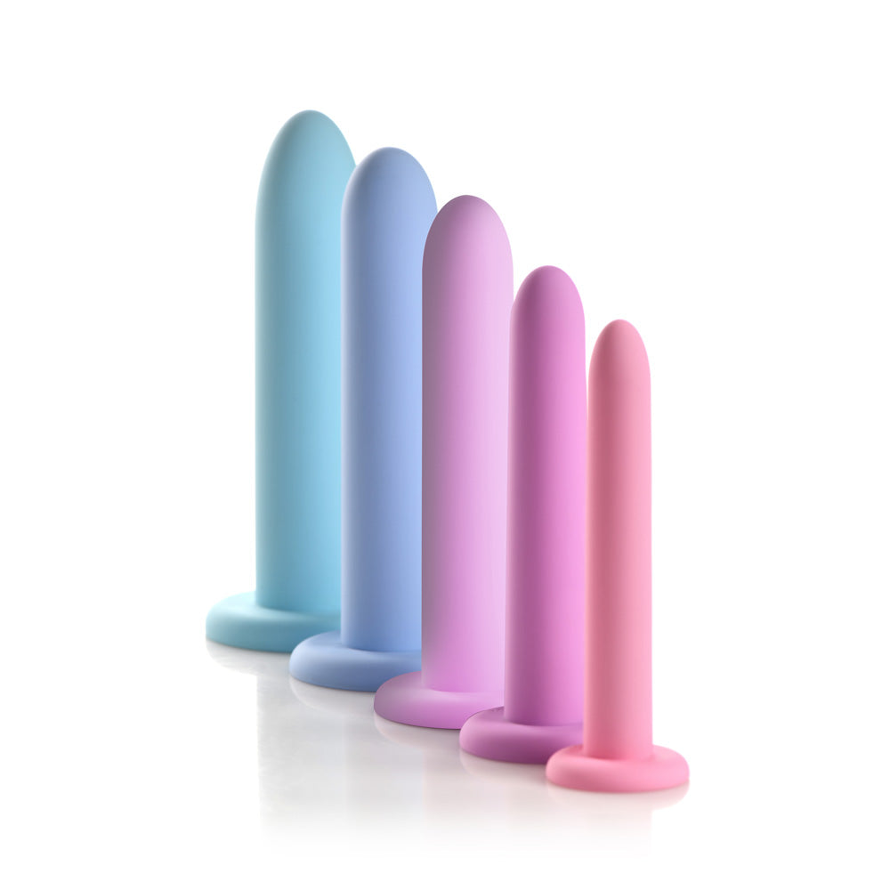 Five silicone dilators in graduated sizes and pastel colors.