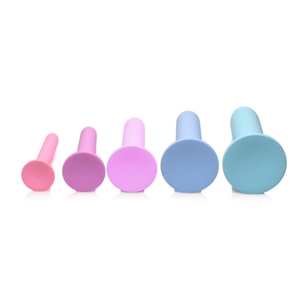 Five silicone dilators in graduated sizes and pastel colors.