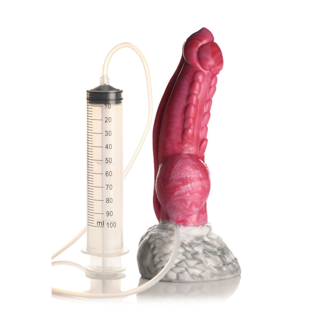 Red silicone fantasy dildo with squirting syringe and hose attached.