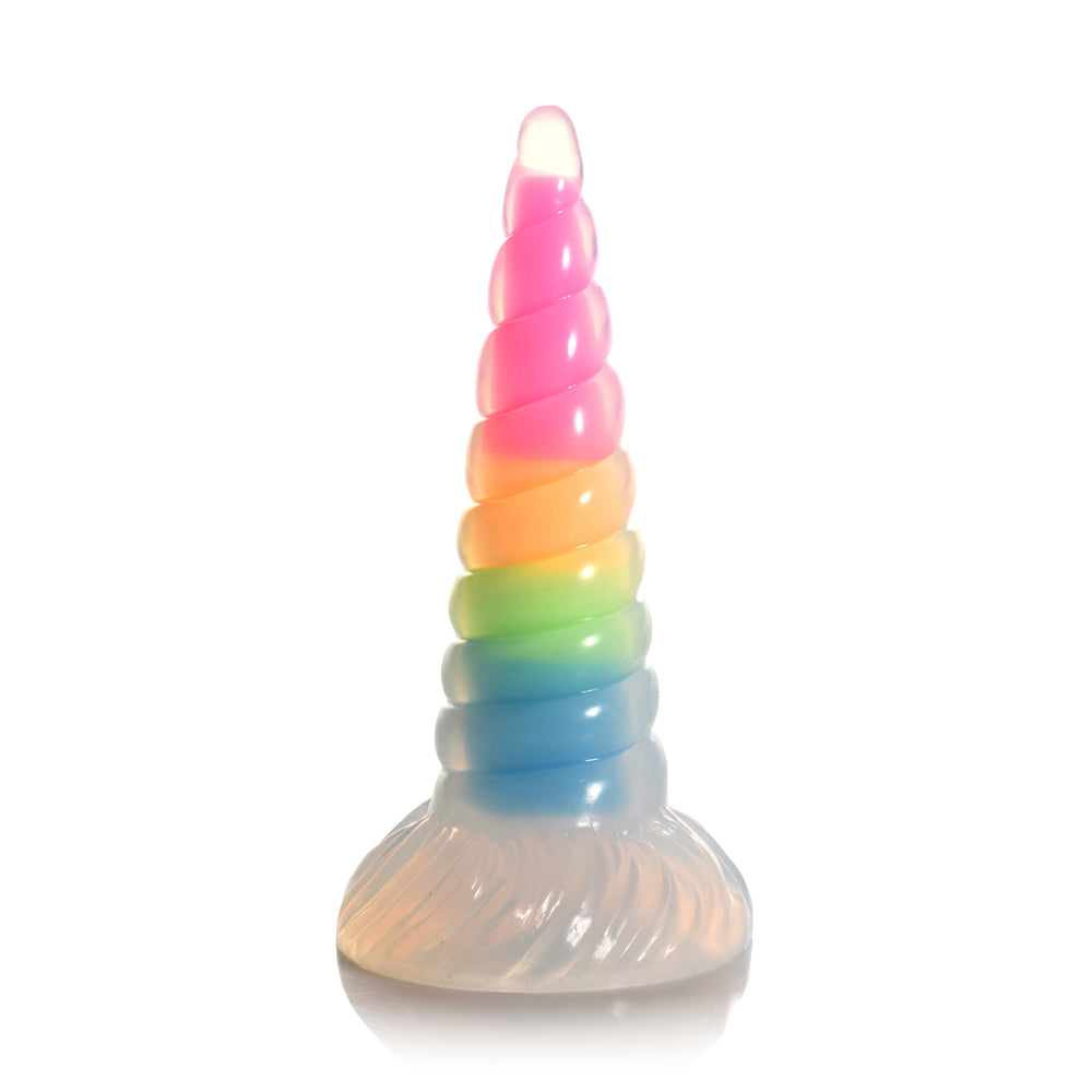 A rainbow-colored unicorn horn dildo made of silicone.
