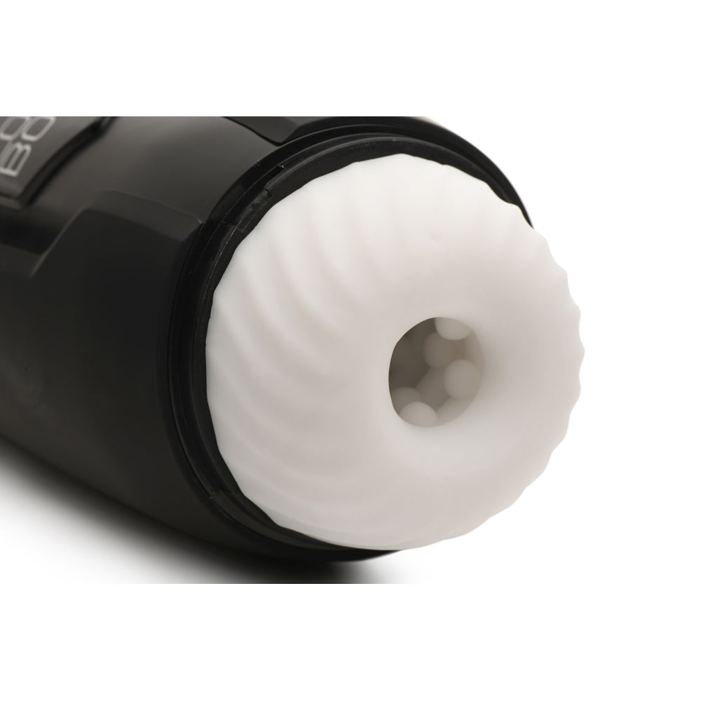 Black masturbator with a white textured sleeve and internal nubs.