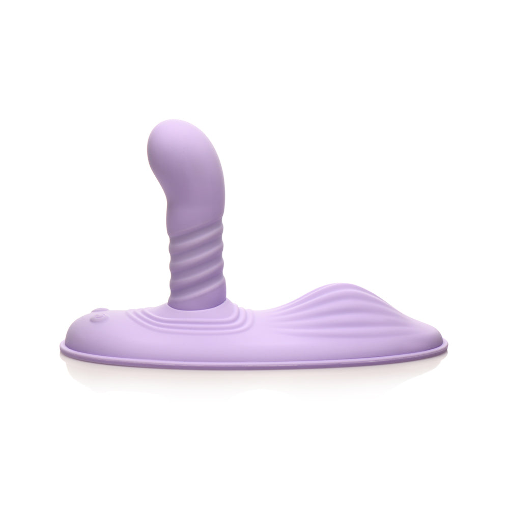 A purple silicone grinding pad with a ribbed shaft and rounded head.