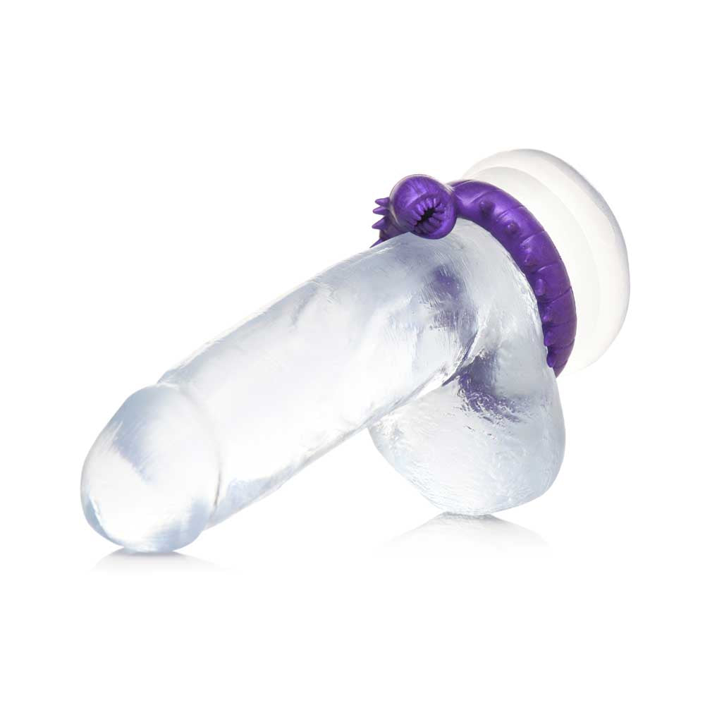 A clear silicone cock ring with a purple, worm-like attachment.