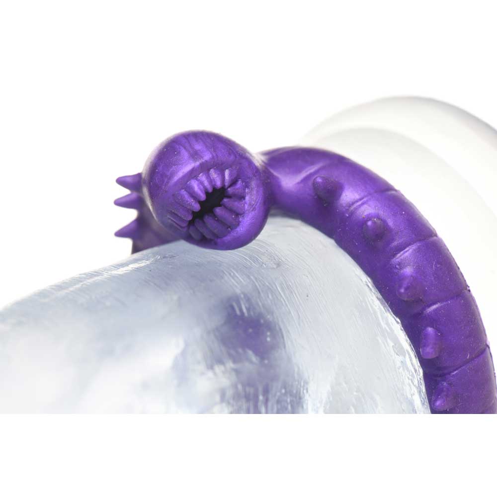 Purple silicone cock ring with a worm-like design.