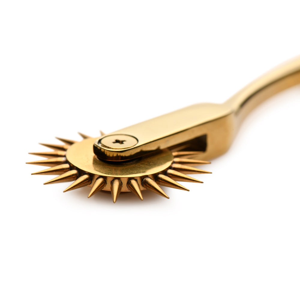 Gold stainless steel Wartenberg sensation wheel with spiked roller.