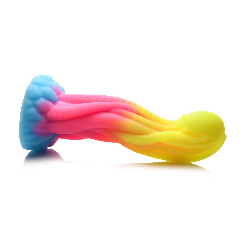 A rainbow-colored silicone dildo with tentacle-like textures.