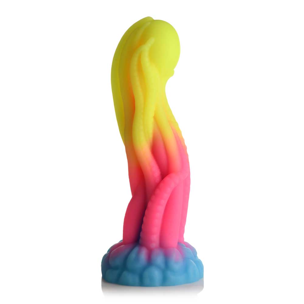 A silicone dildo with yellow, pink, and blue tentacles and a suction base.