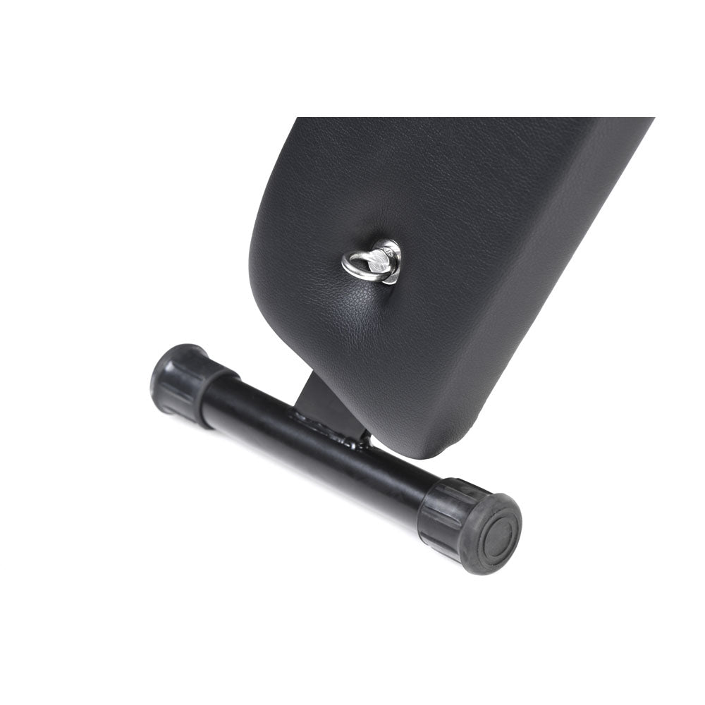 Close-up of a black padded St. Andrew's cross with a metal attachment point and a rubber foot.