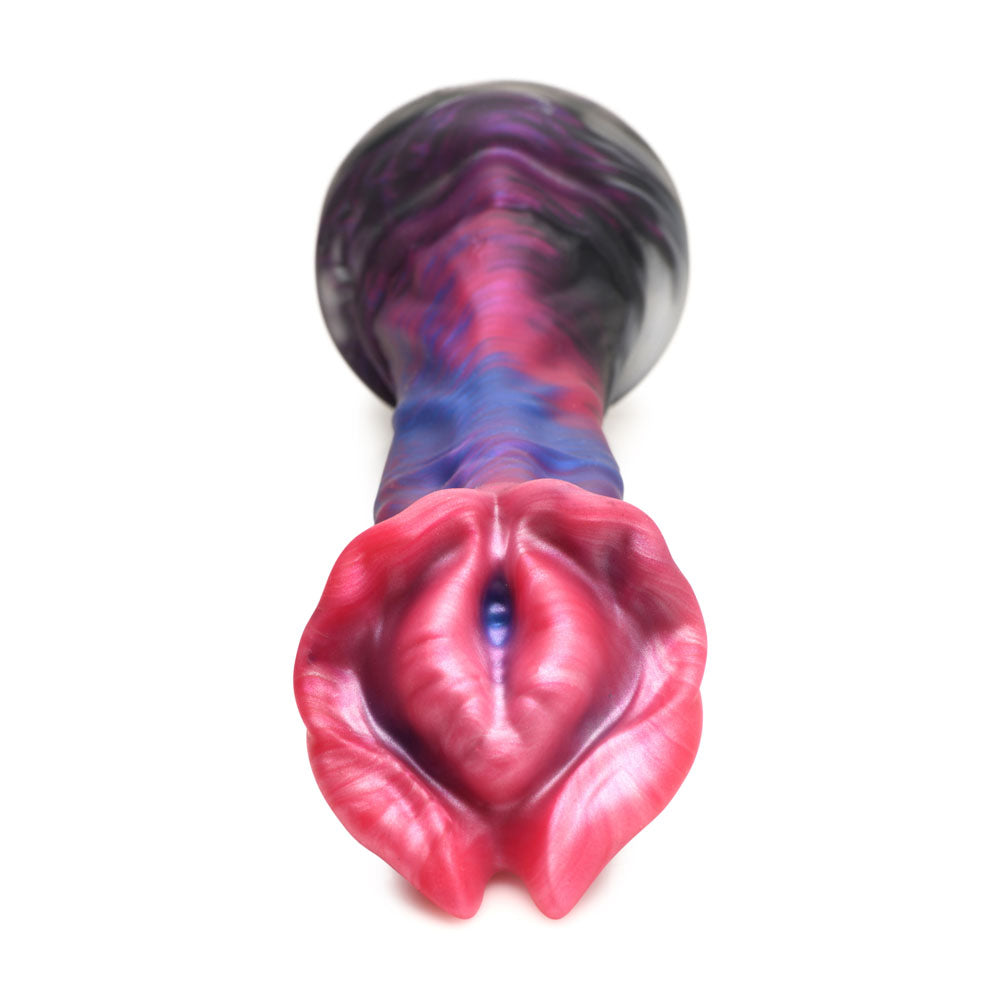 A silicone dildo with a flared, textured head and a suction cup base.