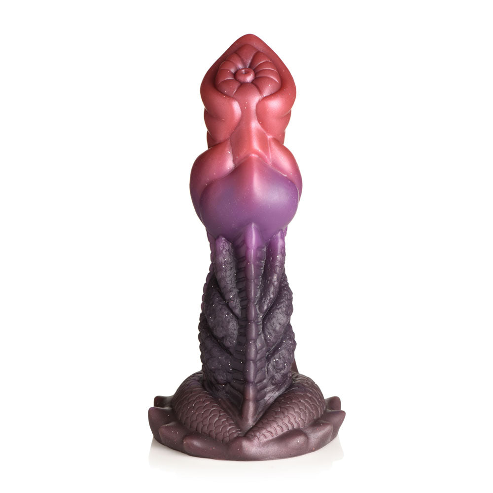 A fantasy dildo with a tapered head, ribbed shaft, and suction cup base in red and purple.