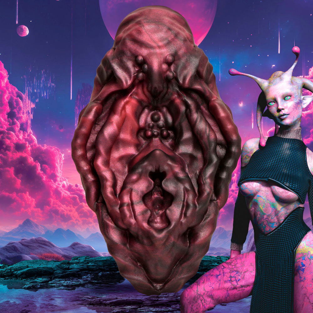 Textured alien-inspired silicone vulva grinder.