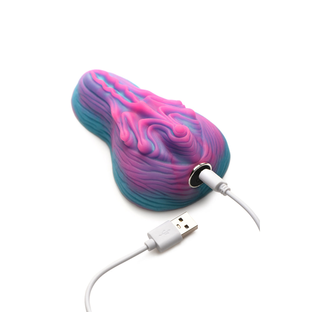 A colorful silicone grinder with a USB charging cable.