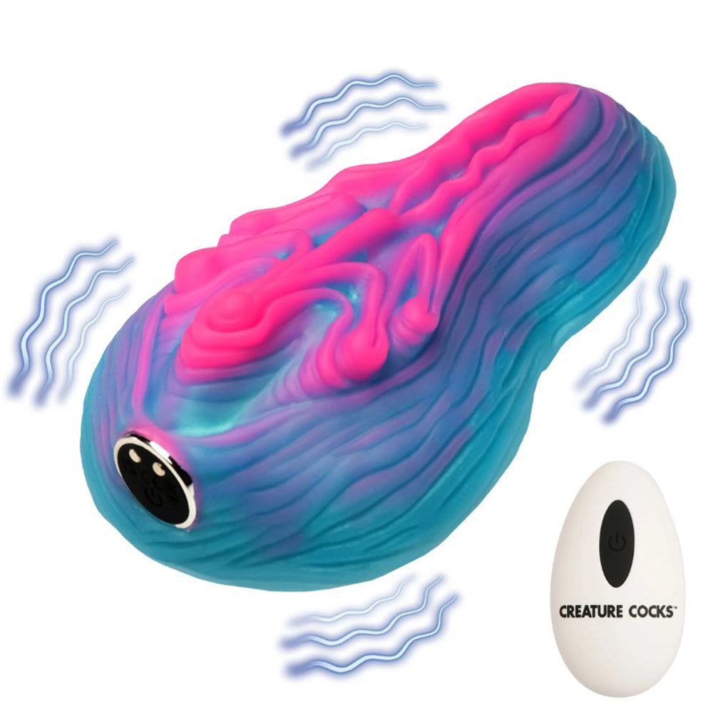 A pink and blue silicone grinder with a remote control.