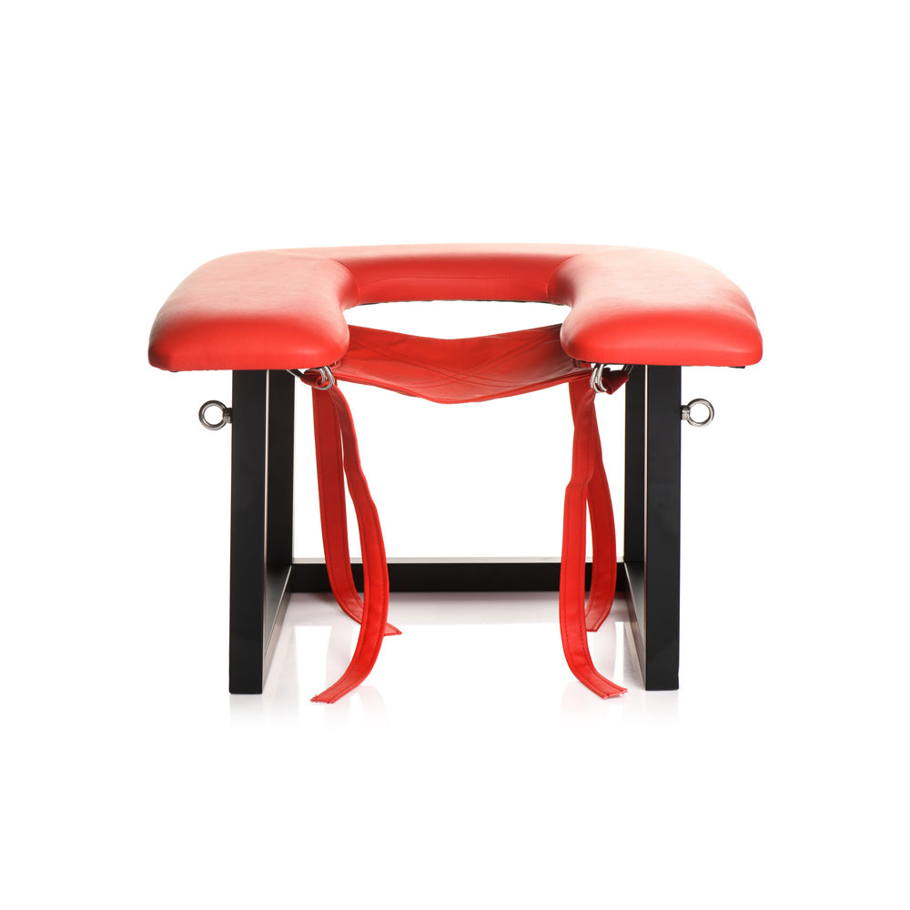 Red vegan leather queening chair with black metal frame and straps.