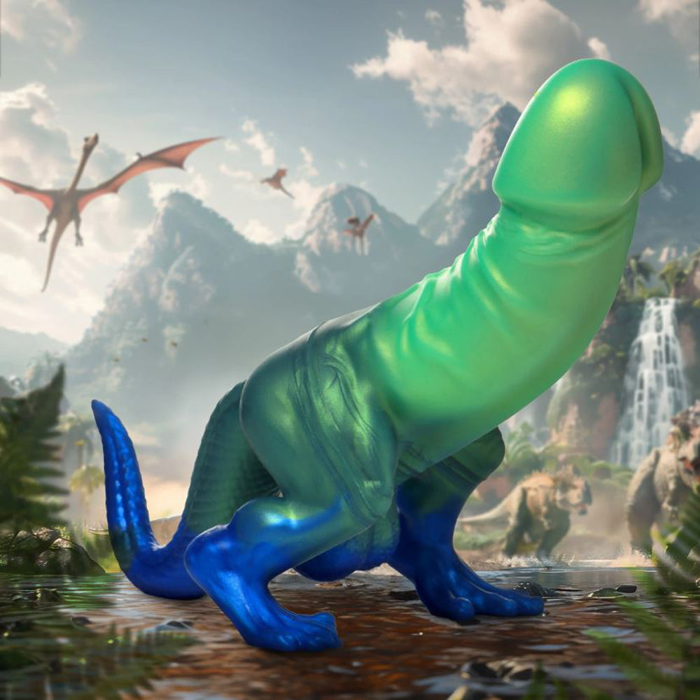 A green and blue dinosaur-shaped dildo with a suction cup base.