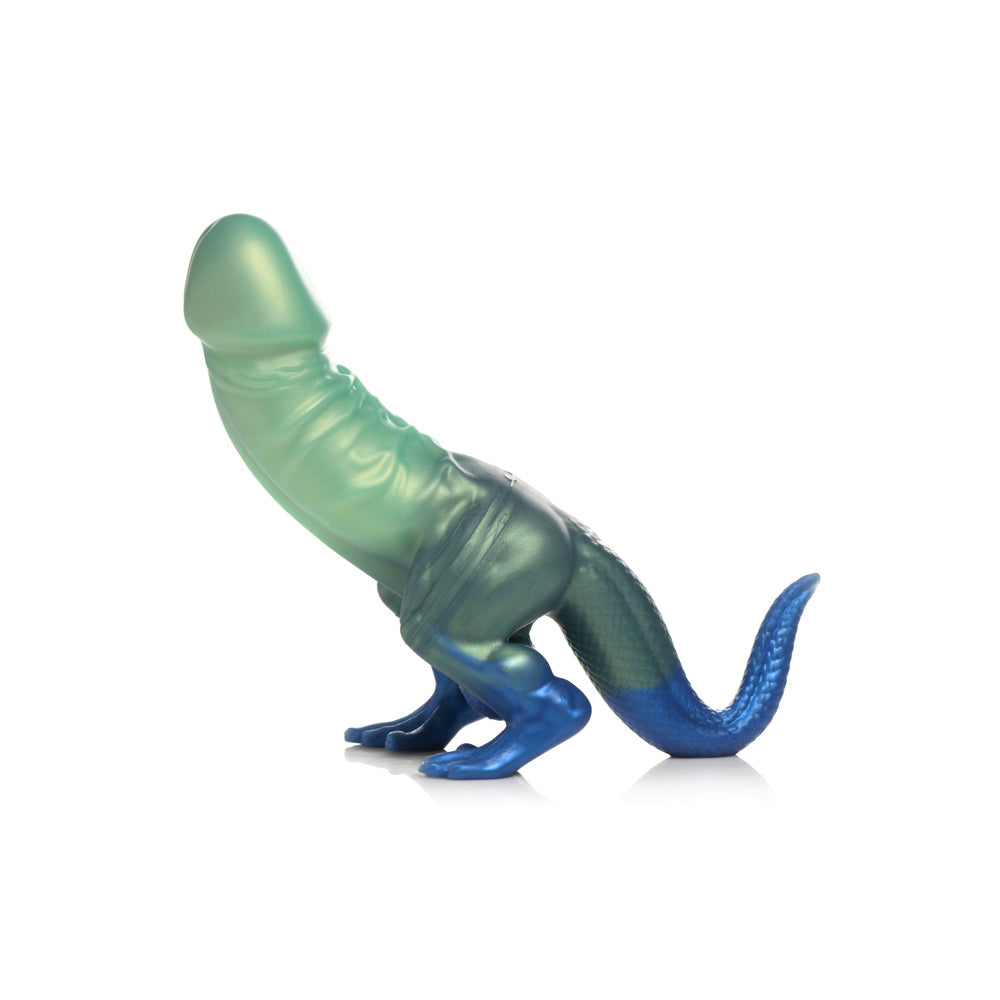 Green and blue silicone dildo with dinosaur-like tail, veins, and suction cup base.