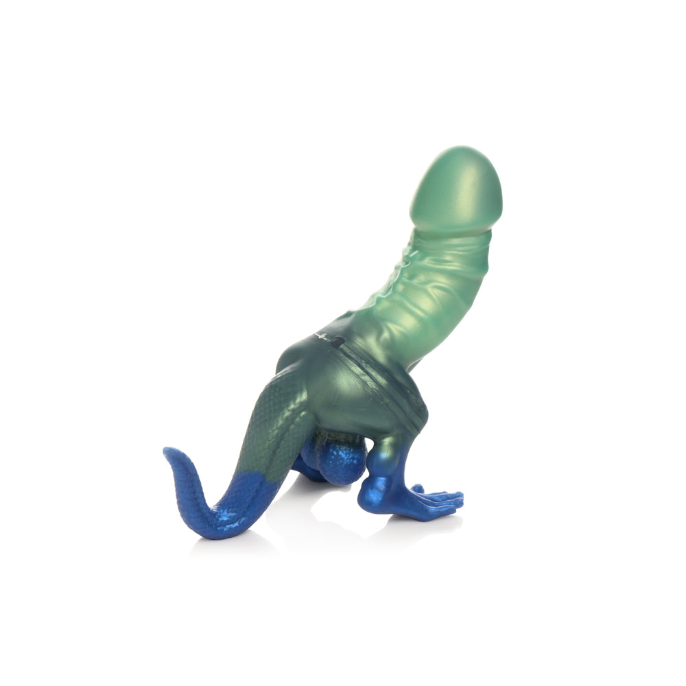 Green silicone dinosaur-shaped dildo with blue accents and suction cup base.