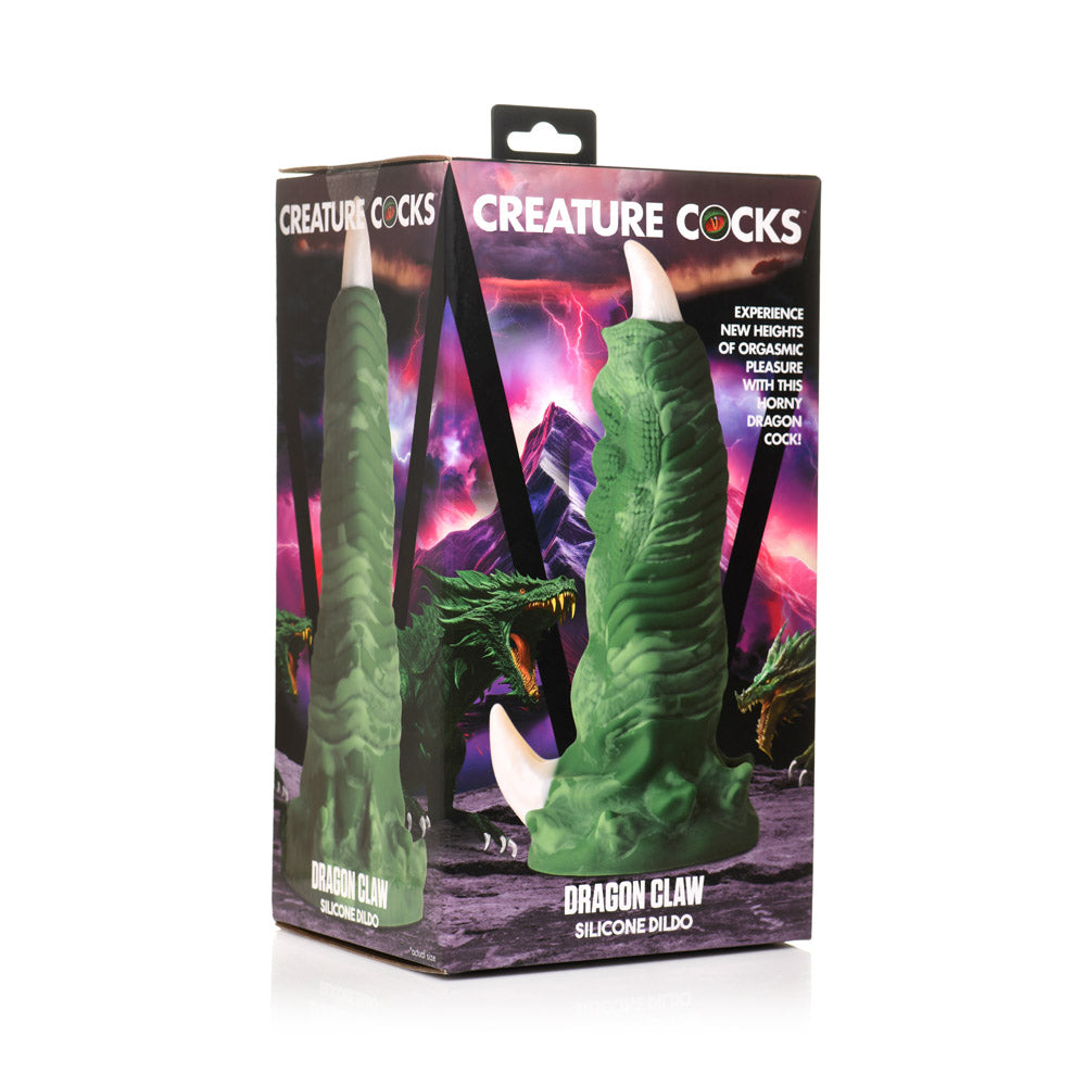 A green dragon claw silicone dildo with a suction cup base.