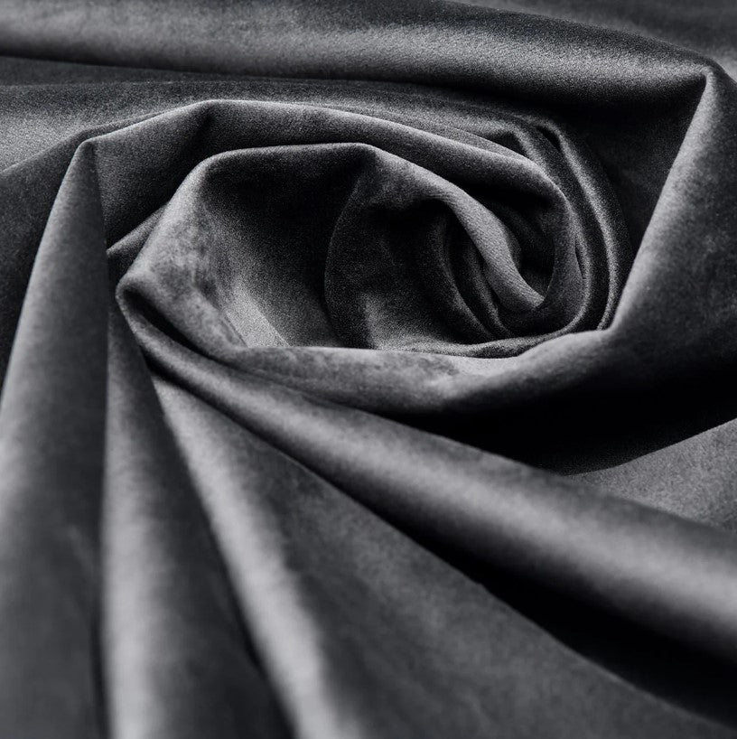 Soft grey velvet fabric with a swirling texture.
