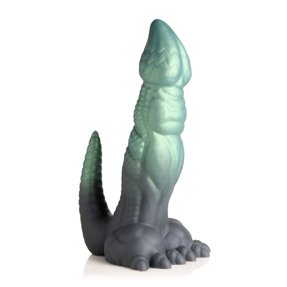 A fantasy silicone dildo shaped like a dinosaur with a suction cup base.