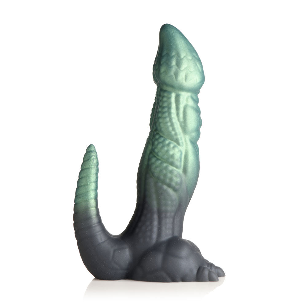 A green and black dinosaur-shaped silicone dildo with a suction cup base.