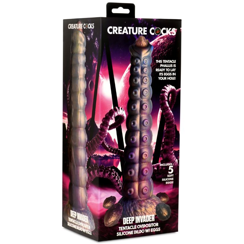 A box displays a silicone dildo with tentacle-like features and alien-inspired design.