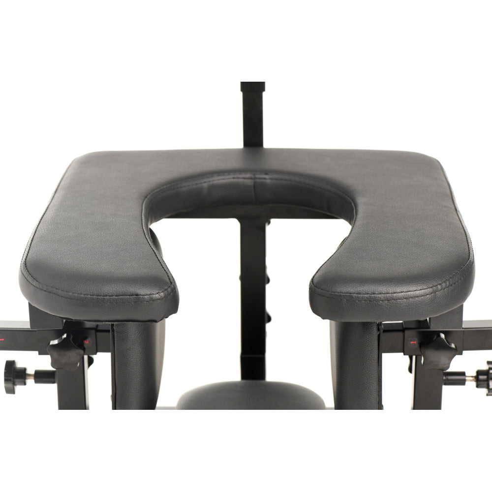 Adjustable black pleasure throne with U-shaped padded seat.