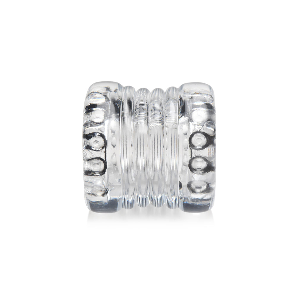 Clear stretchy TPE ball stretcher with stacked rings and textured nubs.