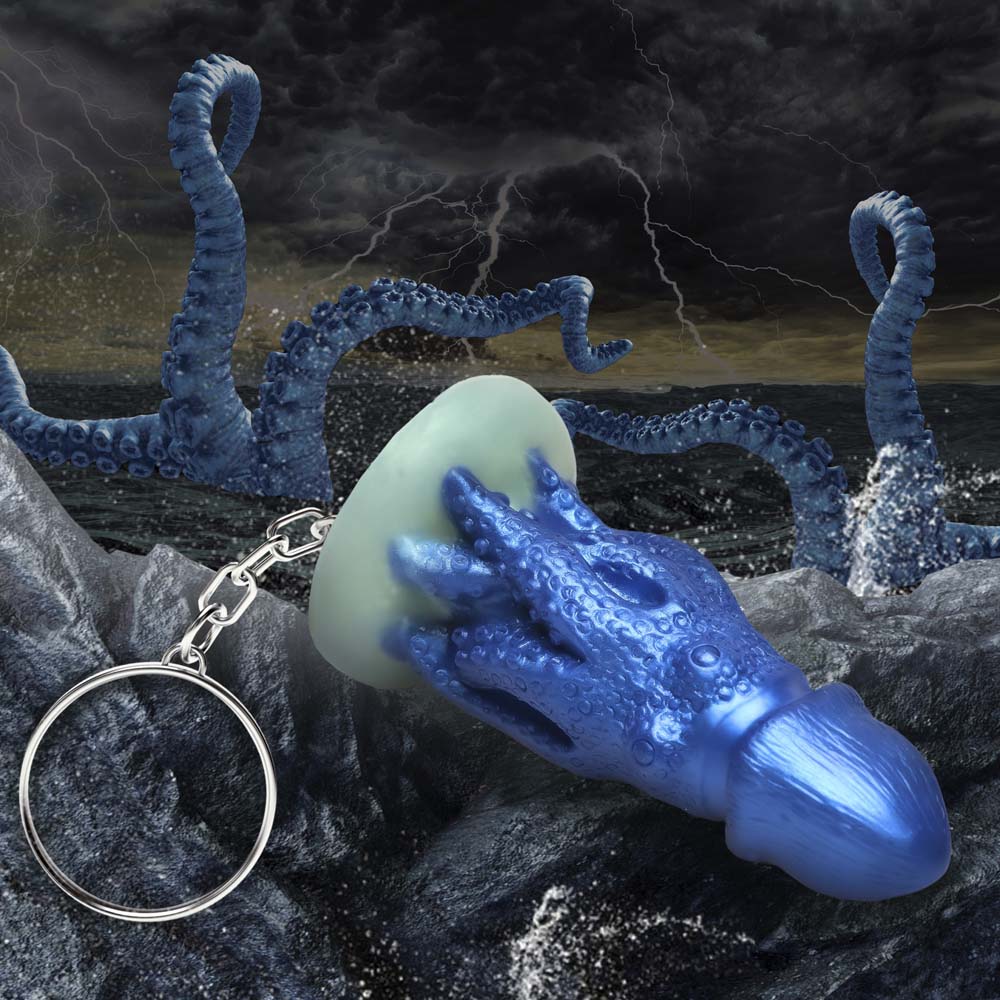Blue silicone octopus creature keychain with tentacles and a keyring.