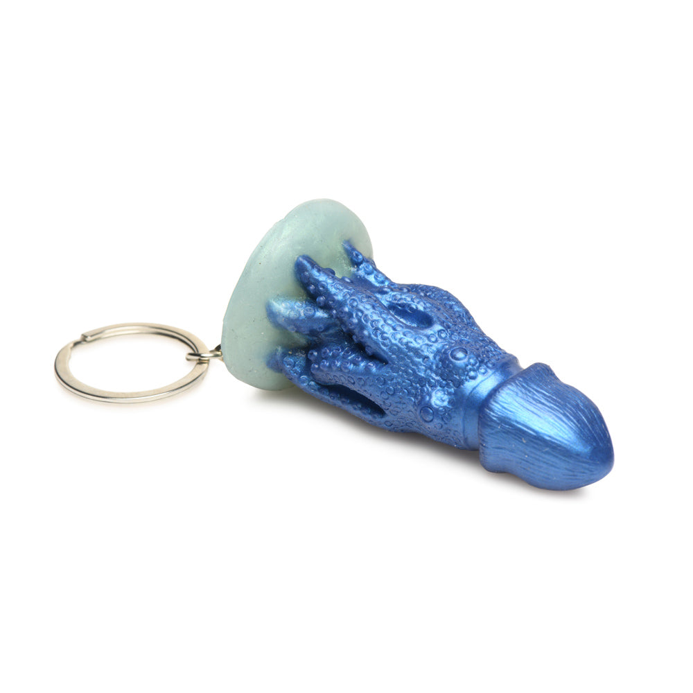 Blue octopus creature keychain with a light blue disc.