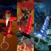 Miniature silicone keychains featuring a king cobra, hell-hound, and kraken.