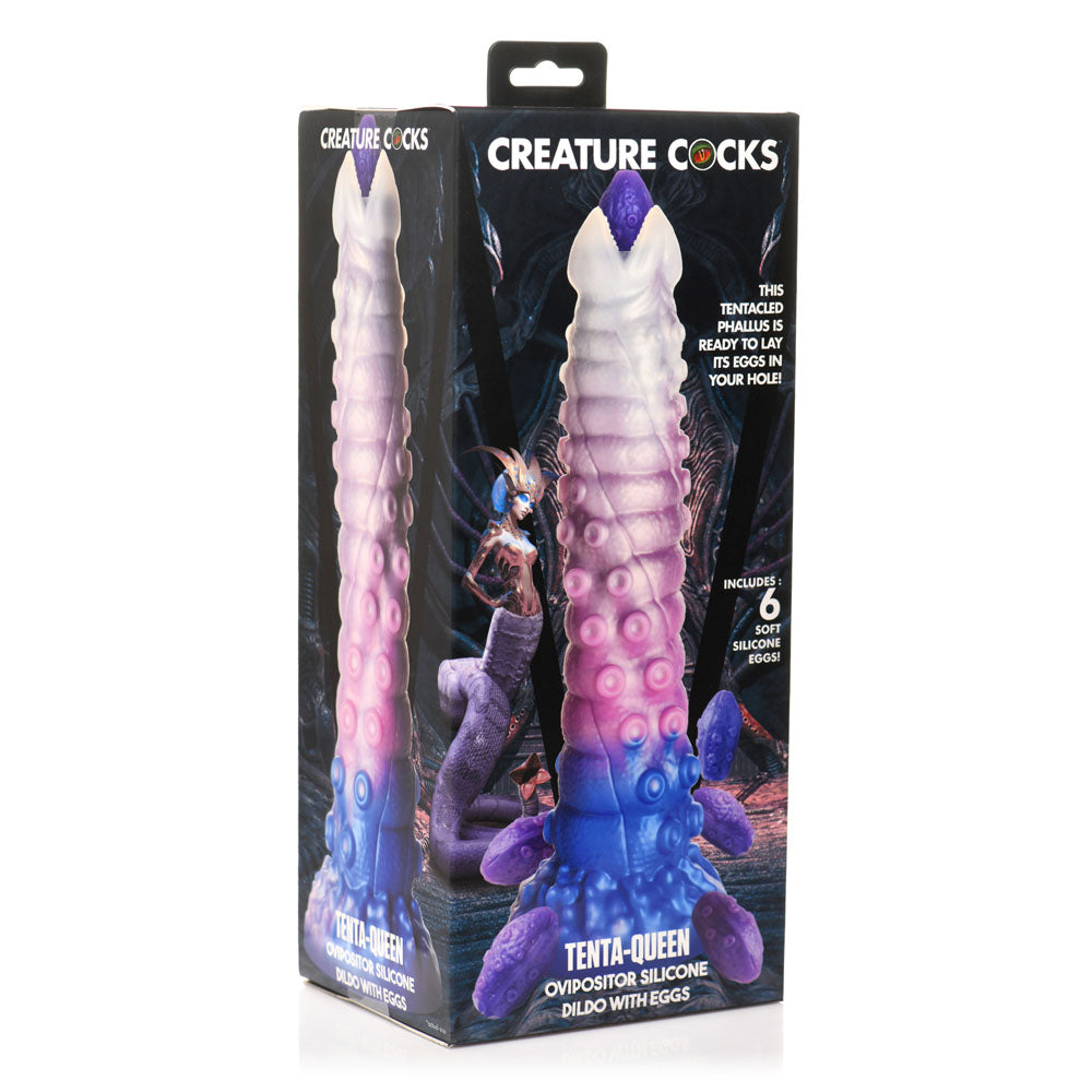 Large purple silicone ovipositor fantasy dildo with eggs in boxed packaging.