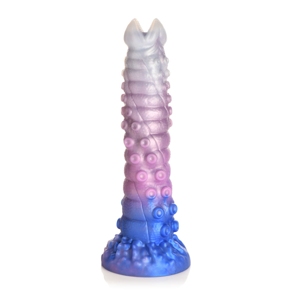 A large, tentacle-shaped dildo with a ribbed shaft, suckers, and a gradient of blue, pink, and white.