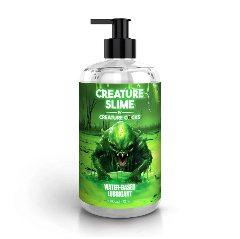 A bottle of Creature Slime water-based lubricant with a green monster graphic.