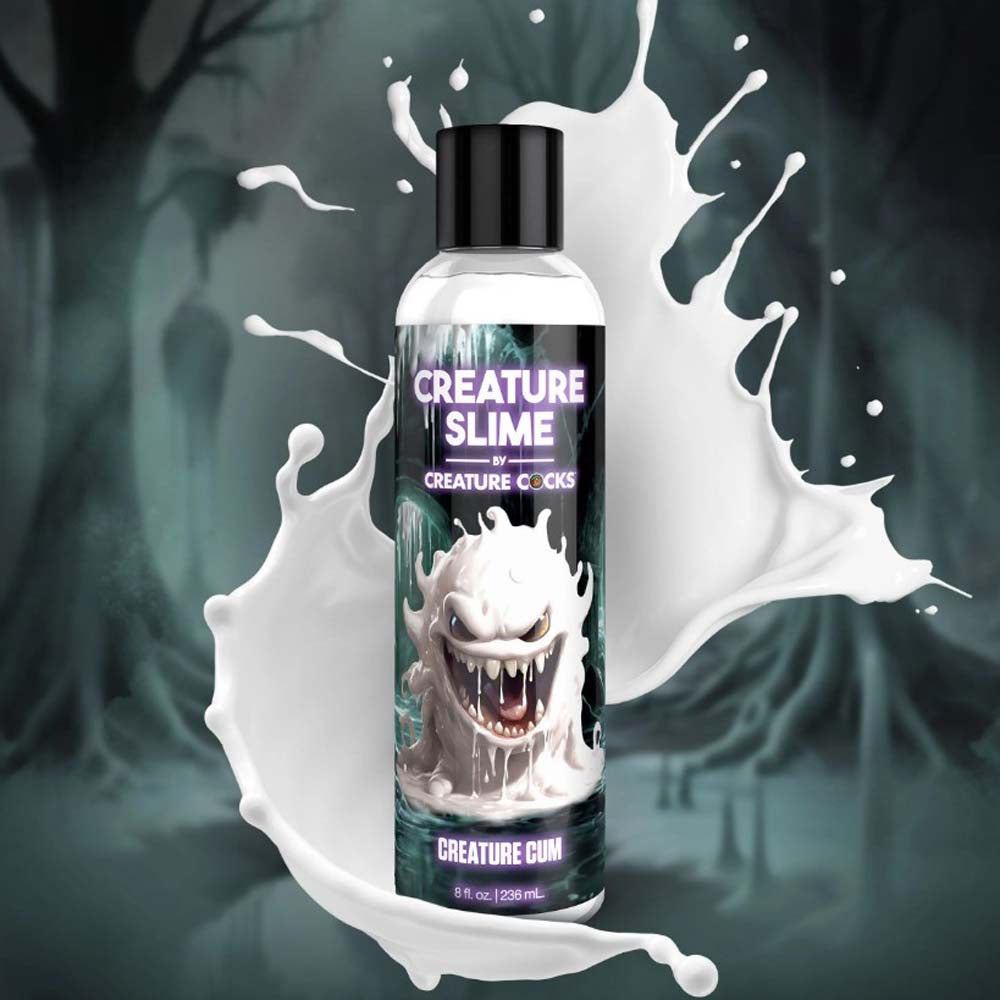 Bottle of Creature Slime by Creature Cocks with a cartoon monster and white liquid splash.