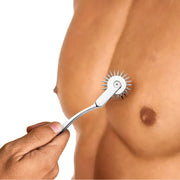 Silver stainless steel Wartenberg pinwheel with zinc alloy handle, shown rolling on a muscular male torso.