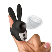 Black silicone bunny clit stimulator on a finger with swirling air effect.