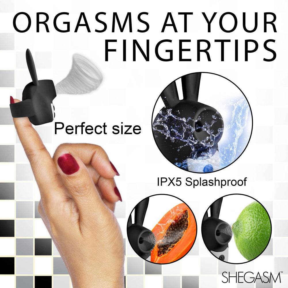 A black silicone clit stimulator with a bunny ear design, shown on a finger and with water and fruit.