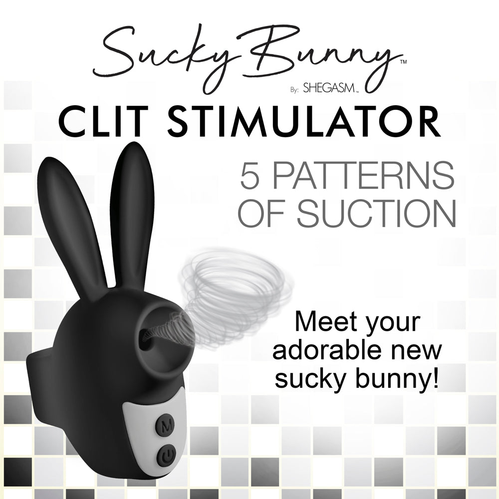 A black bunny-shaped clitoral stimulator with suction patterns.