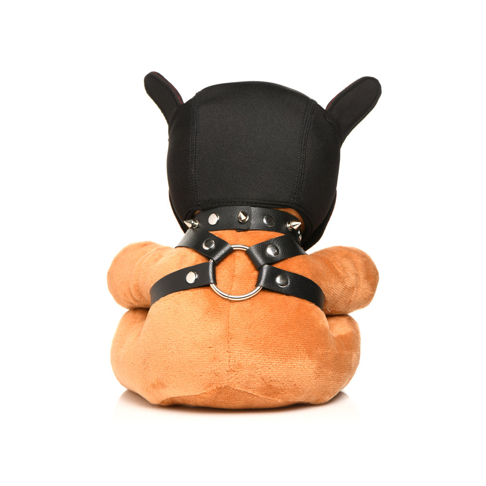A plush teddy bear wearing a black hood, spiked collar, and leather harness.