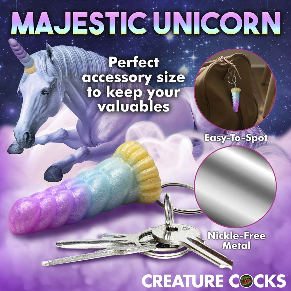 A rainbow unicorn horn keychain with keys.