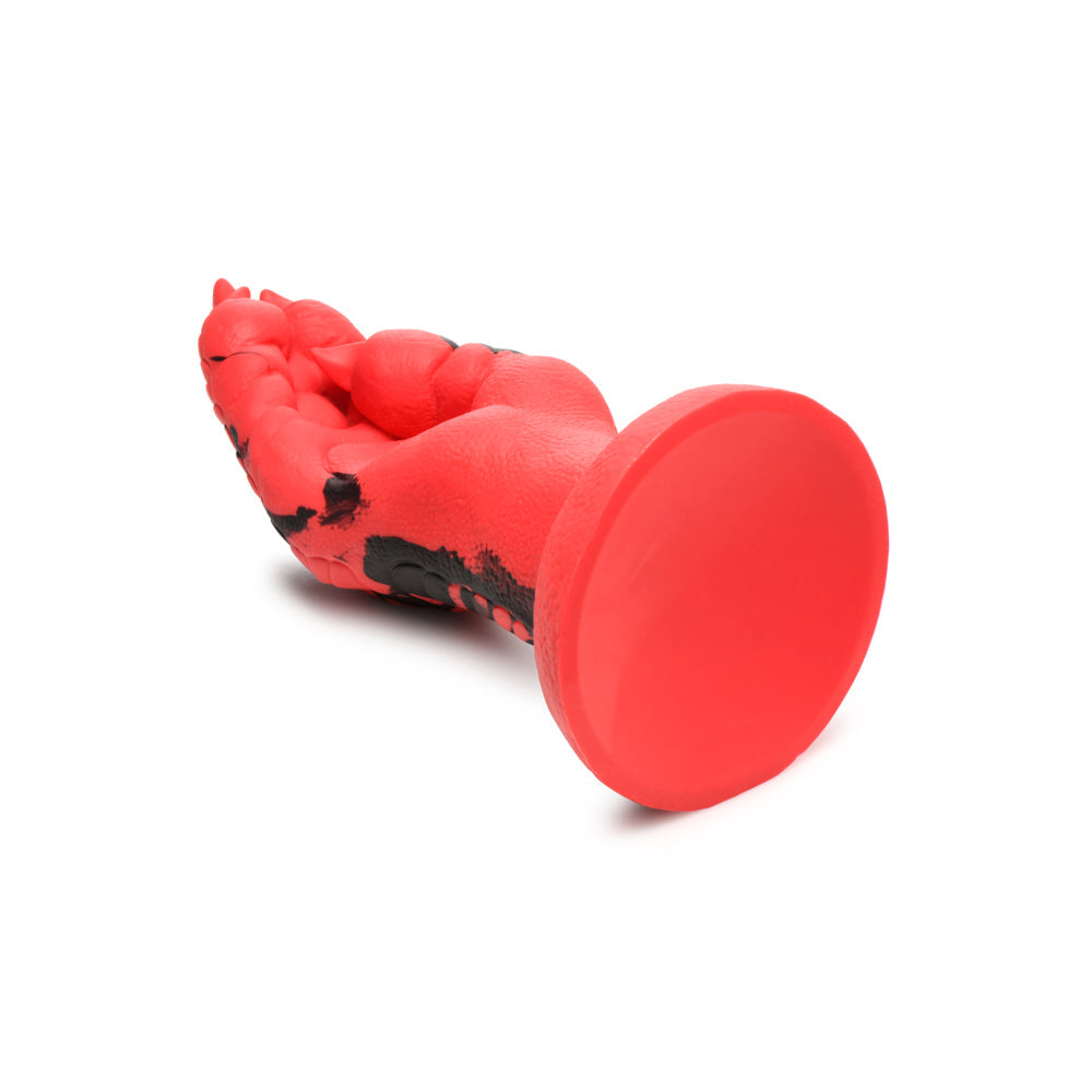 Red silicone dildo shaped like a demon's claw with a suction cup base.