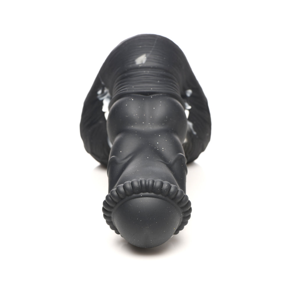 Black silicone dildo with textured head and suction cup base.