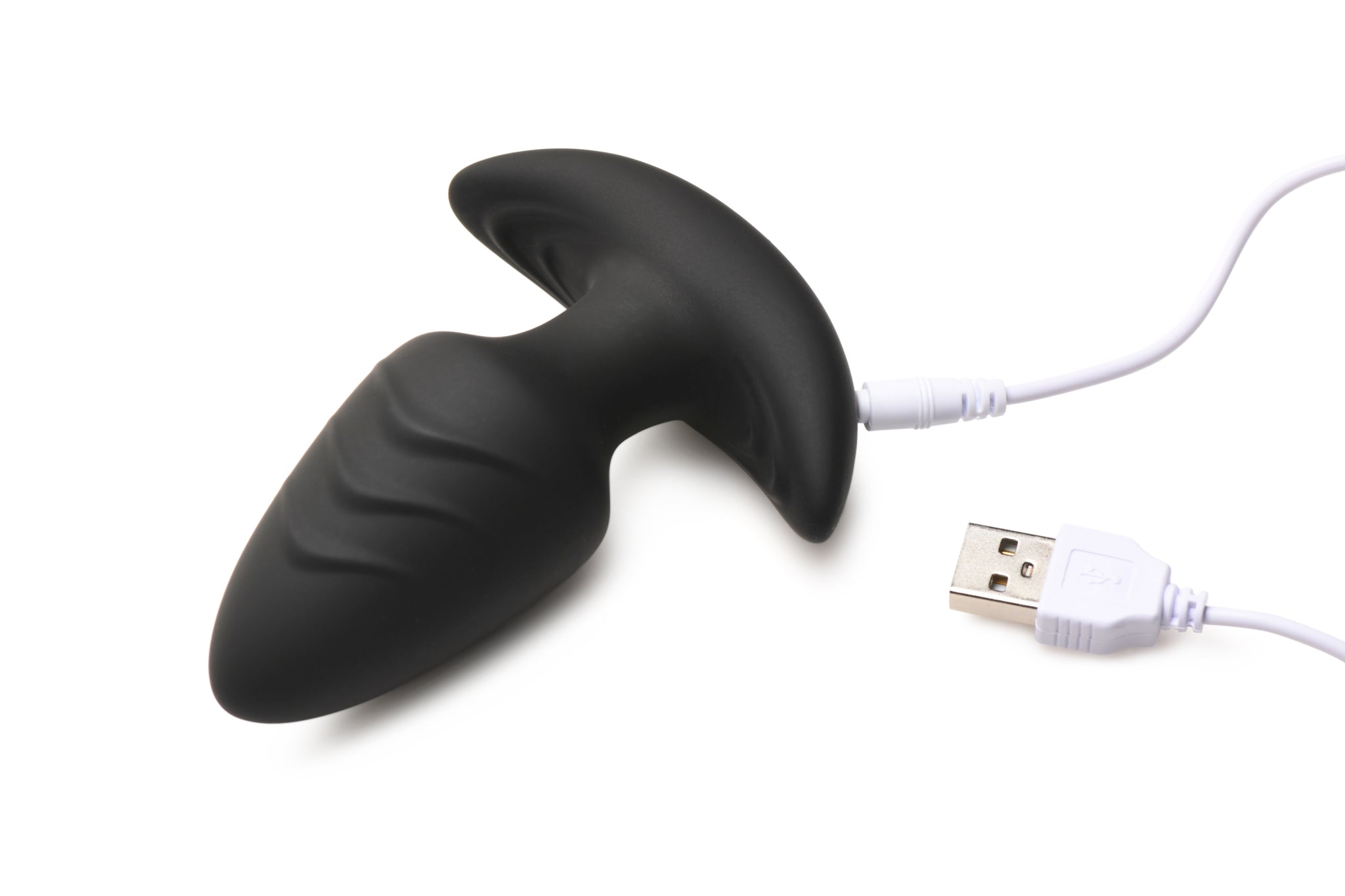 A black silicone anal plug with a white USB charging cable and connector.