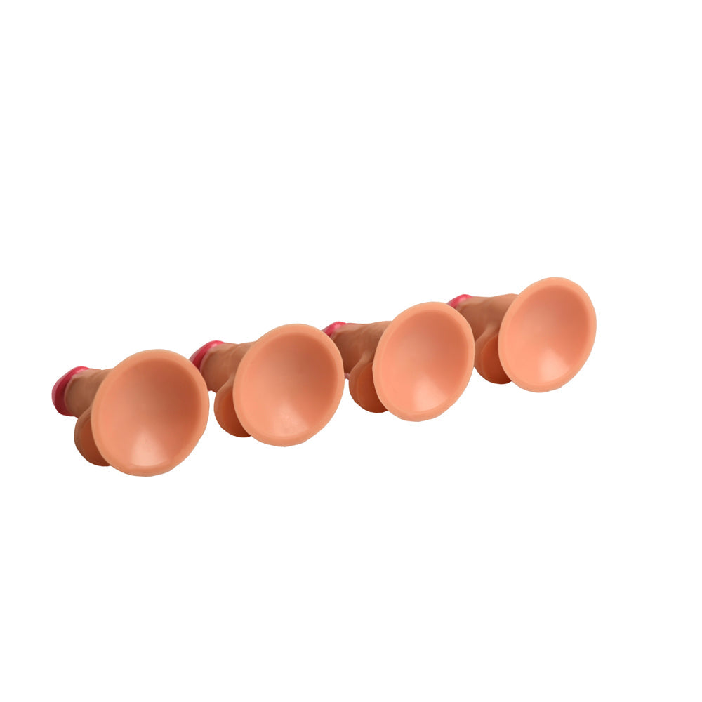 Four mini silicone dildos with suction cup bases.