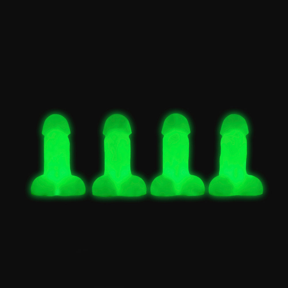 Four glow-in-the-dark mini silicone novelty dildos in green.