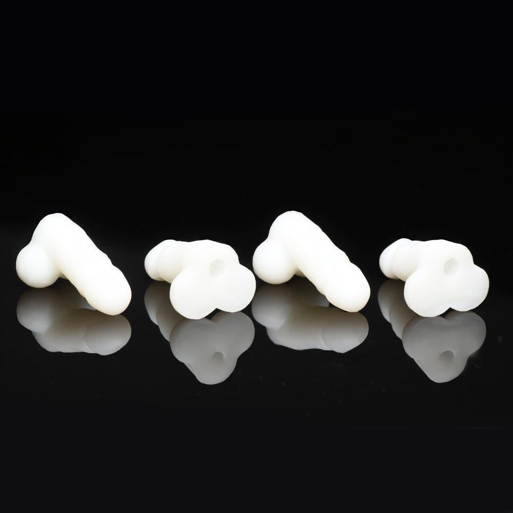 Four white, glow-in-the-dark mini silicone novelty dildos on a black background.