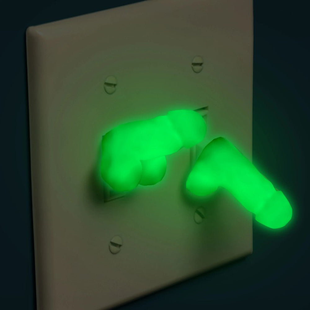 Glow-in-the-dark mini silicone novelty dildos attached to a light switch.