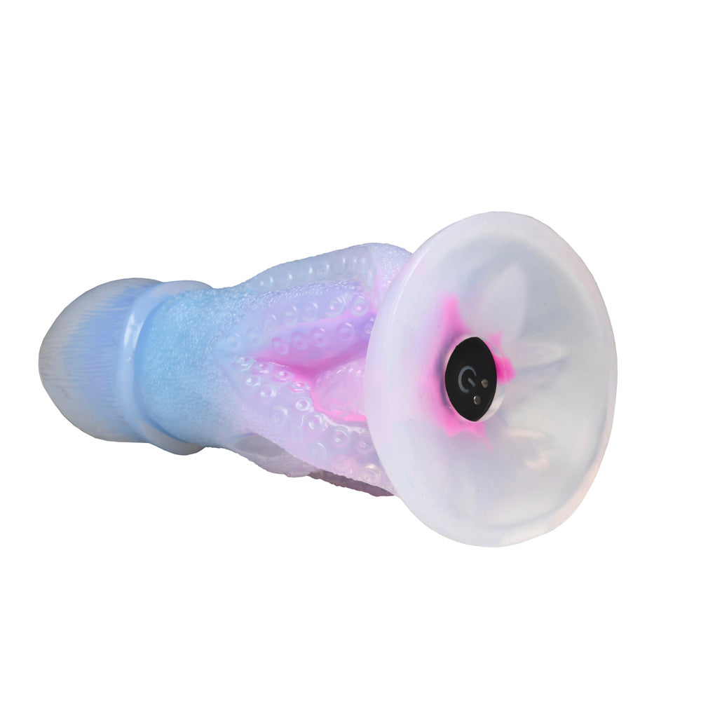 Glow-in-the-dark octopus dildo with textured tentacles and a suction base.