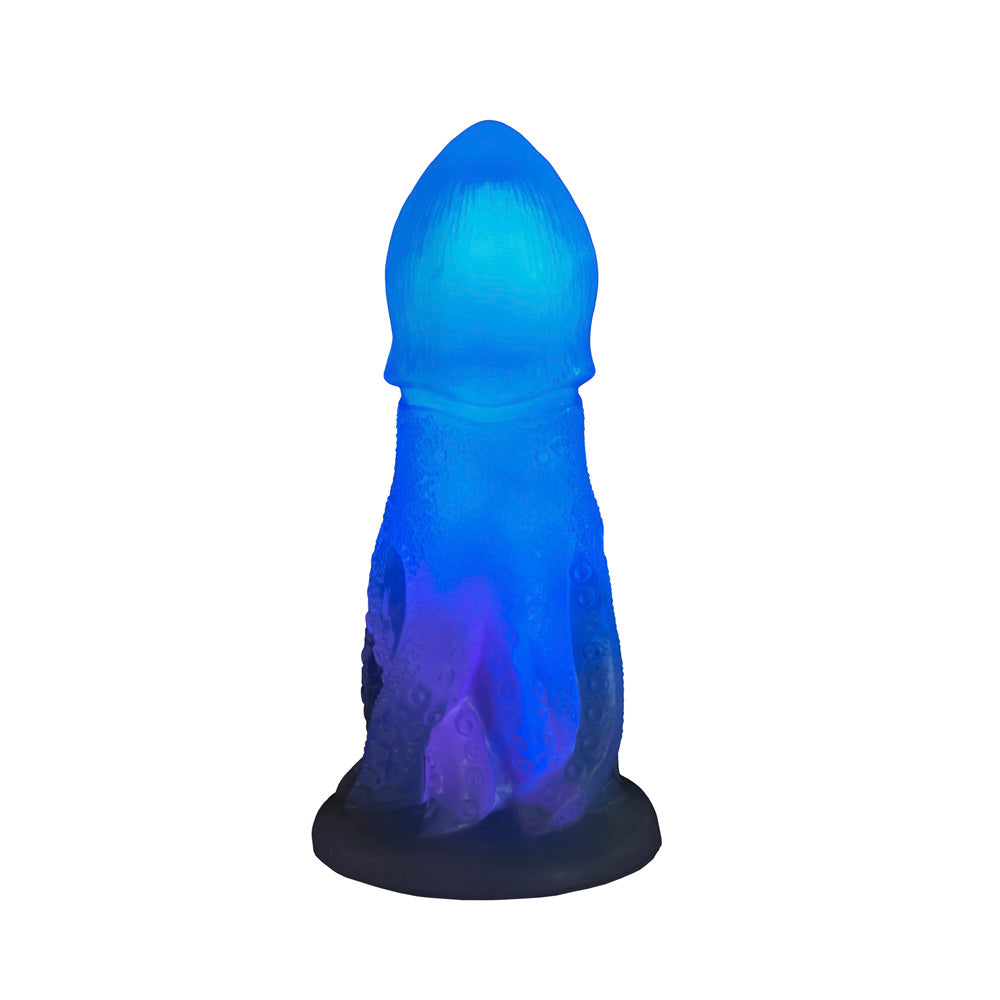 A blue and purple glowing silicone dildo shaped like an octopus with textured tentacles.